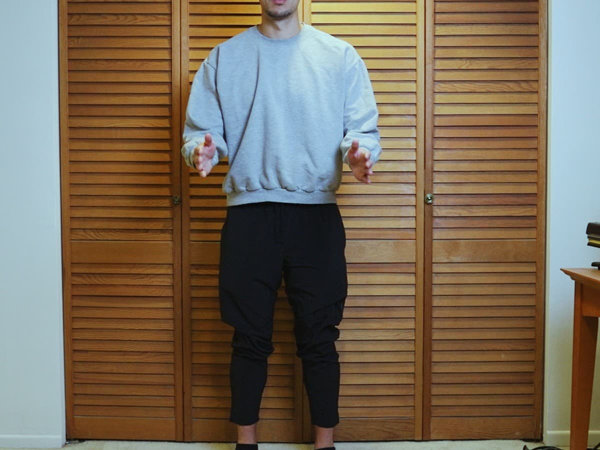 Man posing at zero degree angle from the camera.