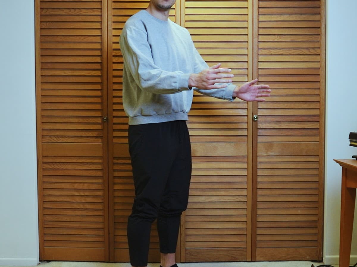 Man posing at 45 degree angle from the camera.