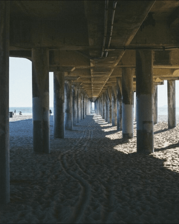 Underneath the pier.