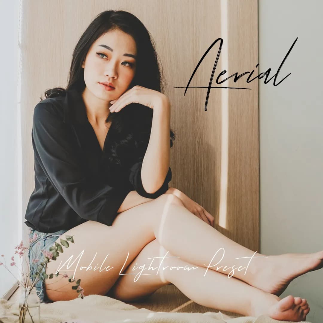 Asian woman sitting on wooden bench.