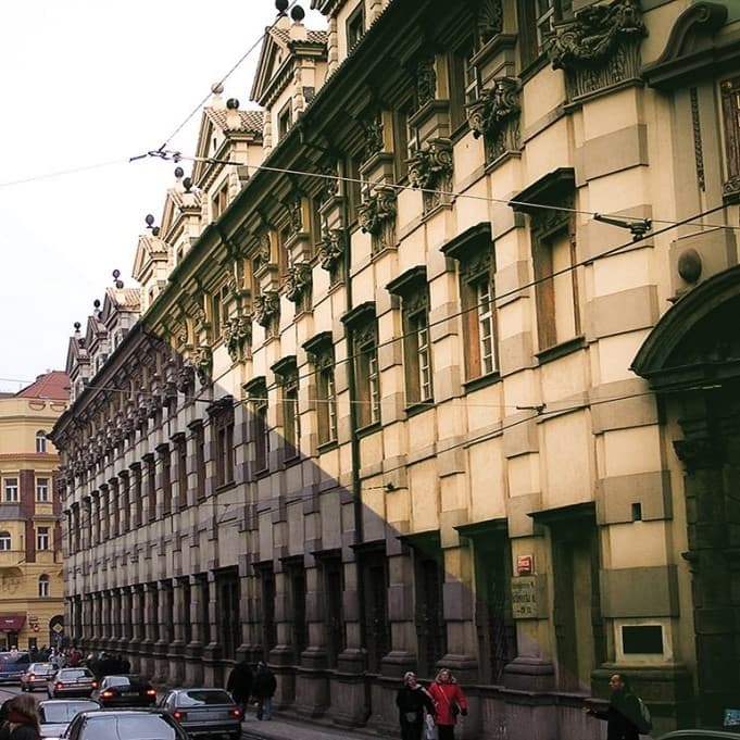 Building with cars in front.