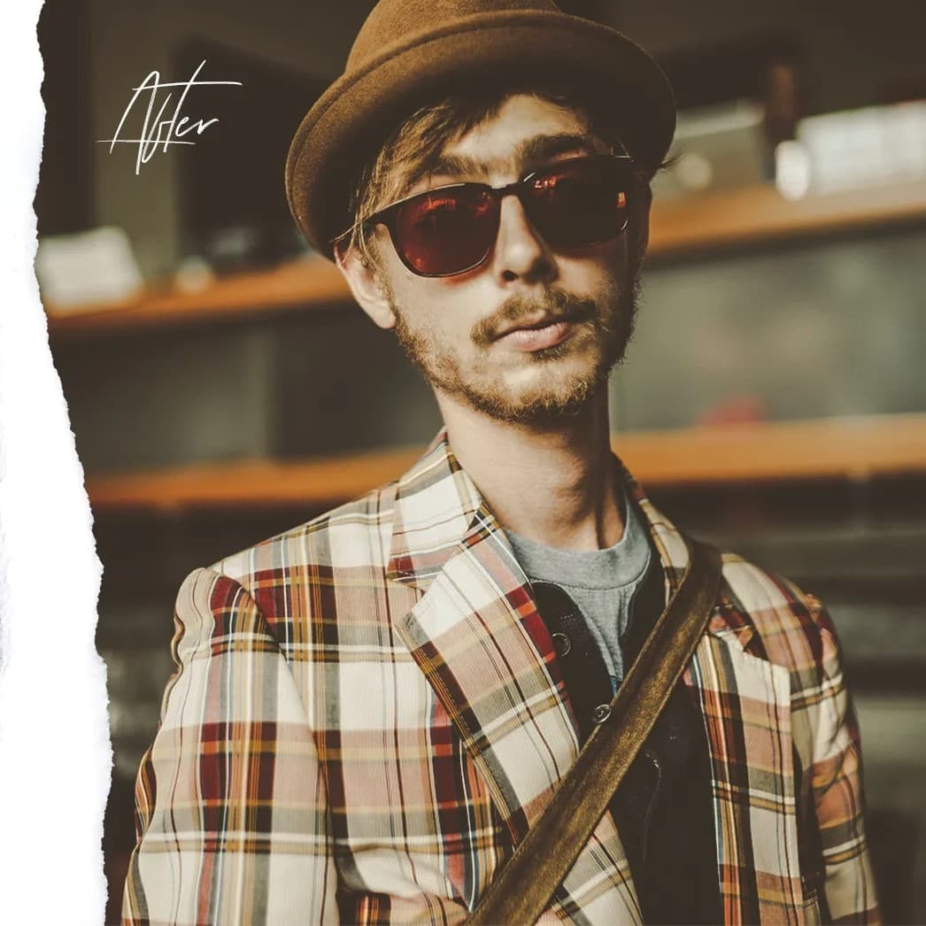 Man in sunglasses looking at camera.