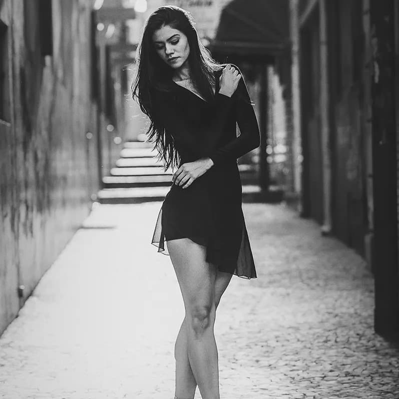 Woman standing on tip toes.