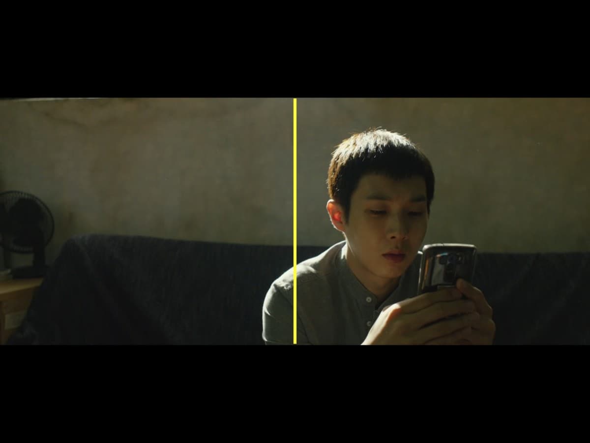 Scene from Parasite where Ki-woo is on phone.