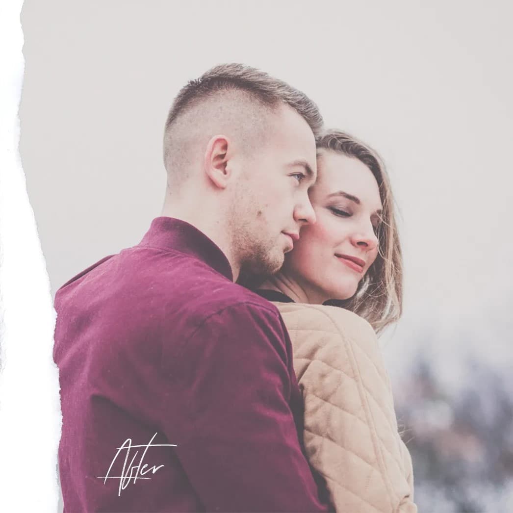 Man hugging woman from behind.
