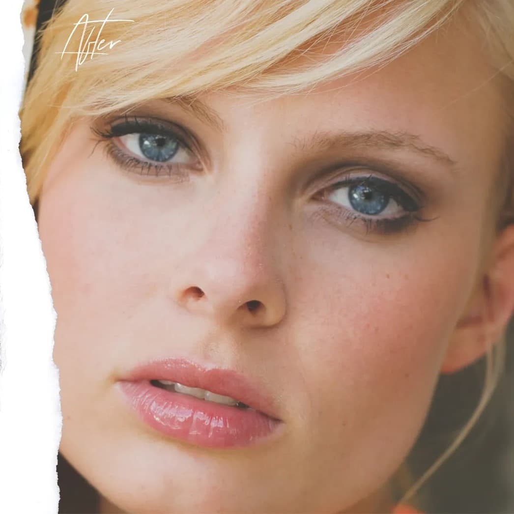 Blue-eyed woman looking at camera.