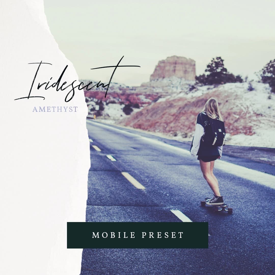Woman skateboarding down an empty road.