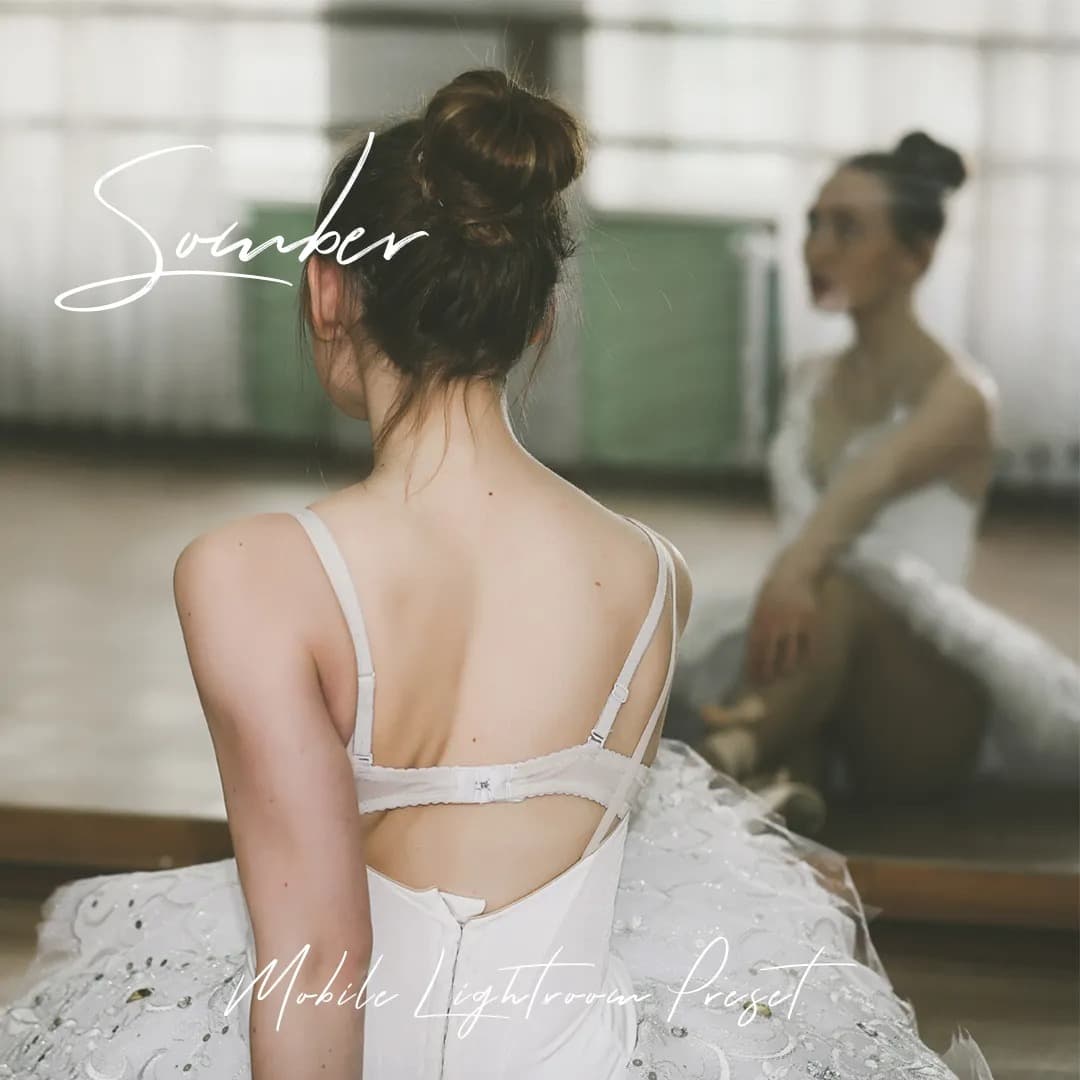 Ballerina stretching and looking at mirror.