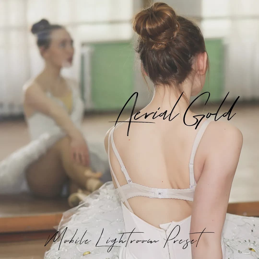 Ballerina stretching looking at mirror.