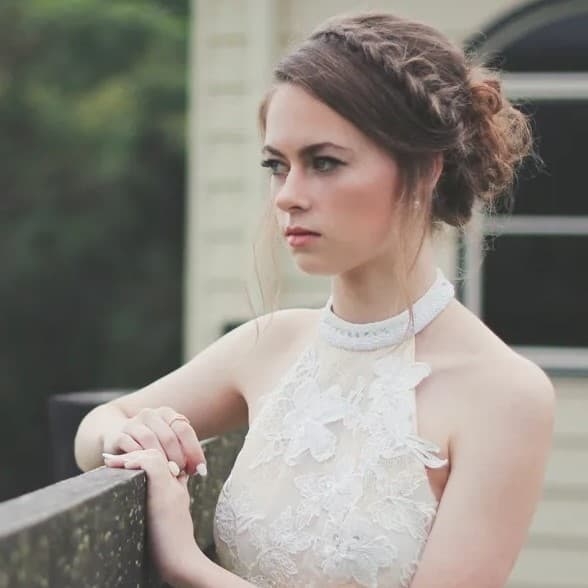Woman in dress looking right.