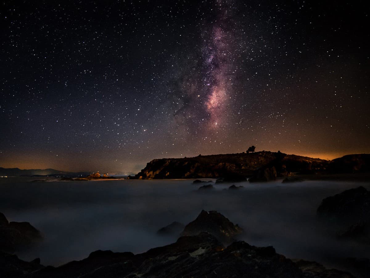 Mountains and the Milky Way in the sky.