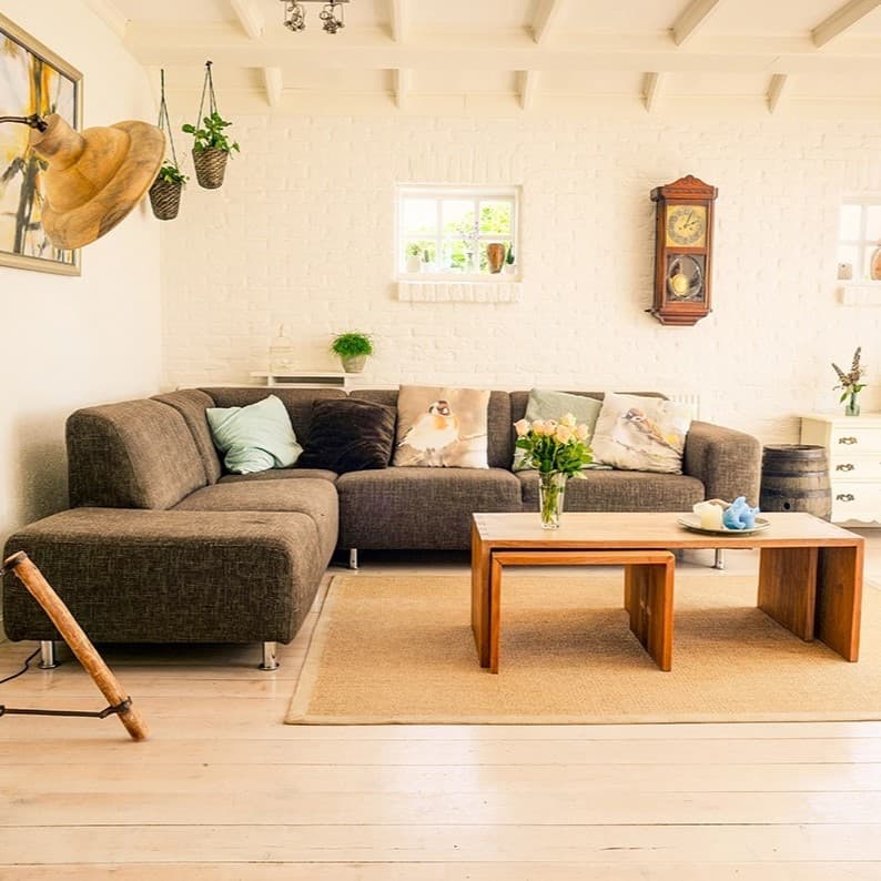Brown room with a sofa and a center table.