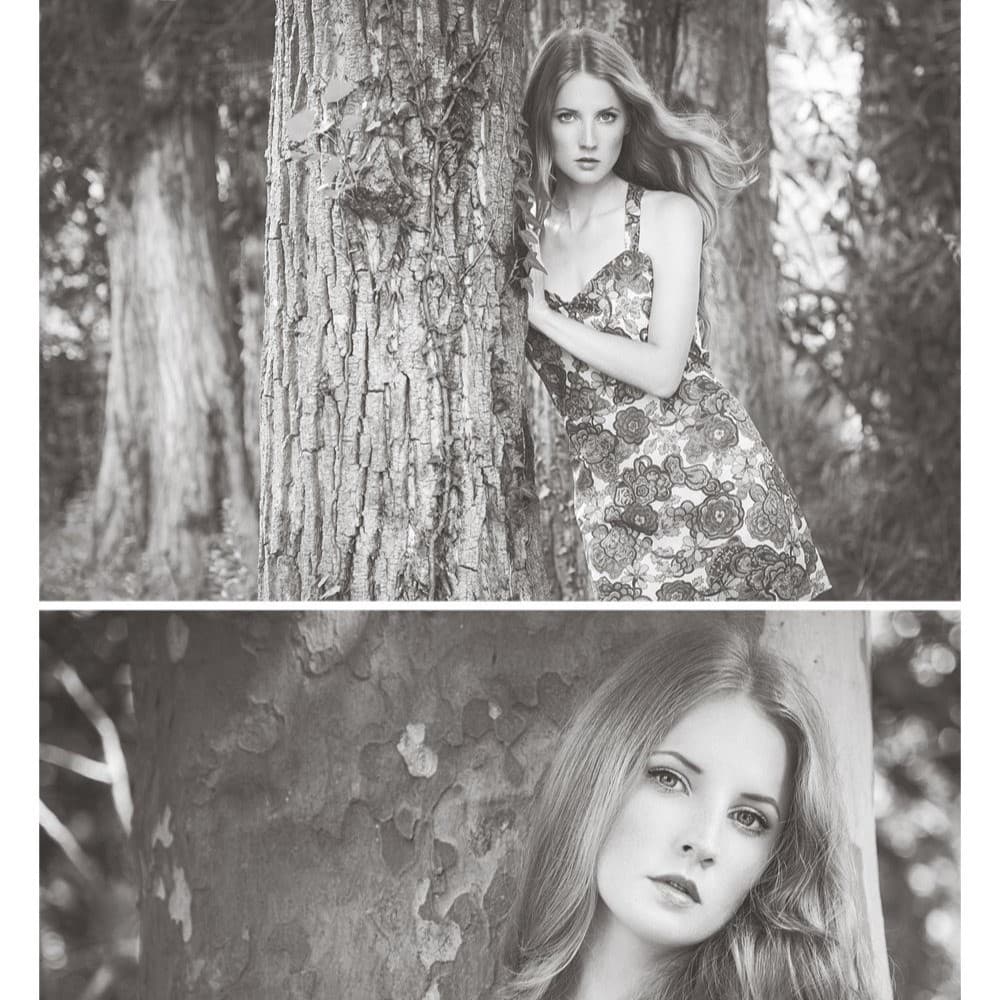 Black and white portrait of women leaning against tree.