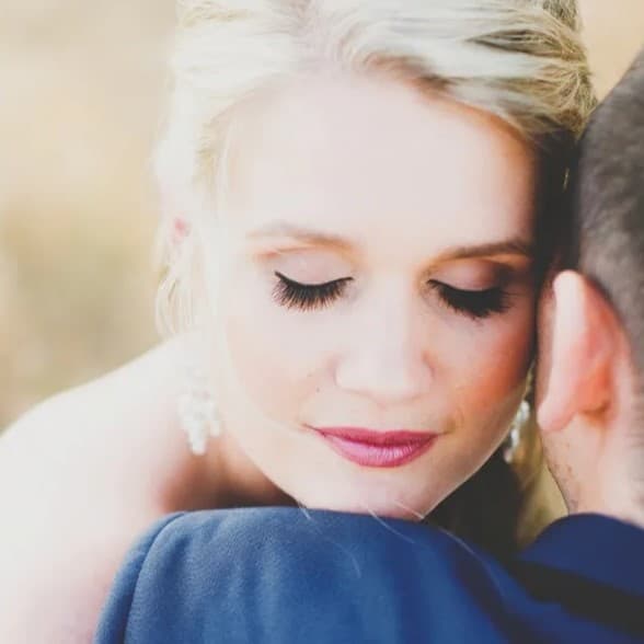 Man hugging a woman.