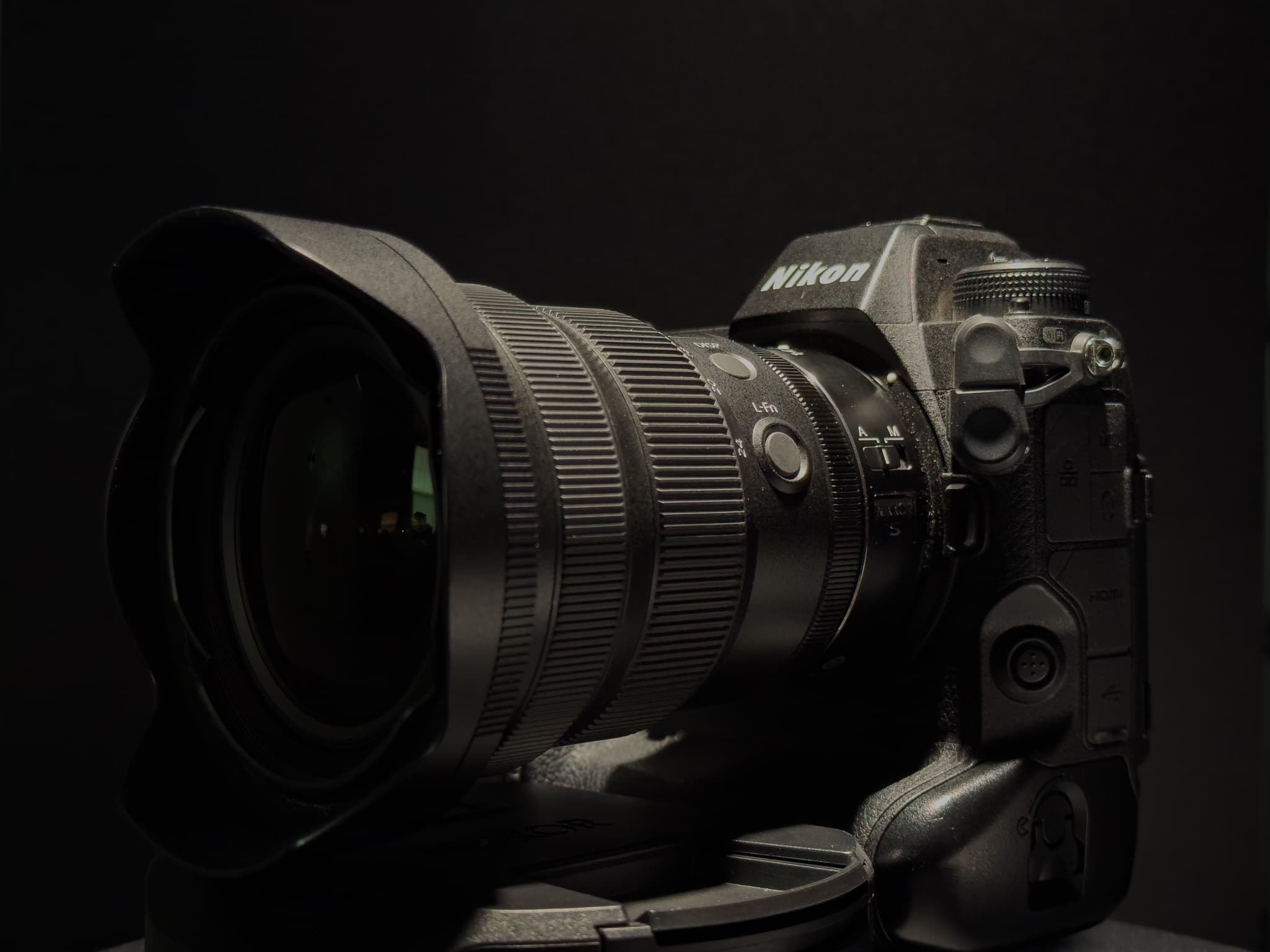 The Nikon Z 14-24mm f/2.8 S mounted to a Nikon body to show its remarkably compact scale and balanced footprint compared to older F-mount ultra-wides