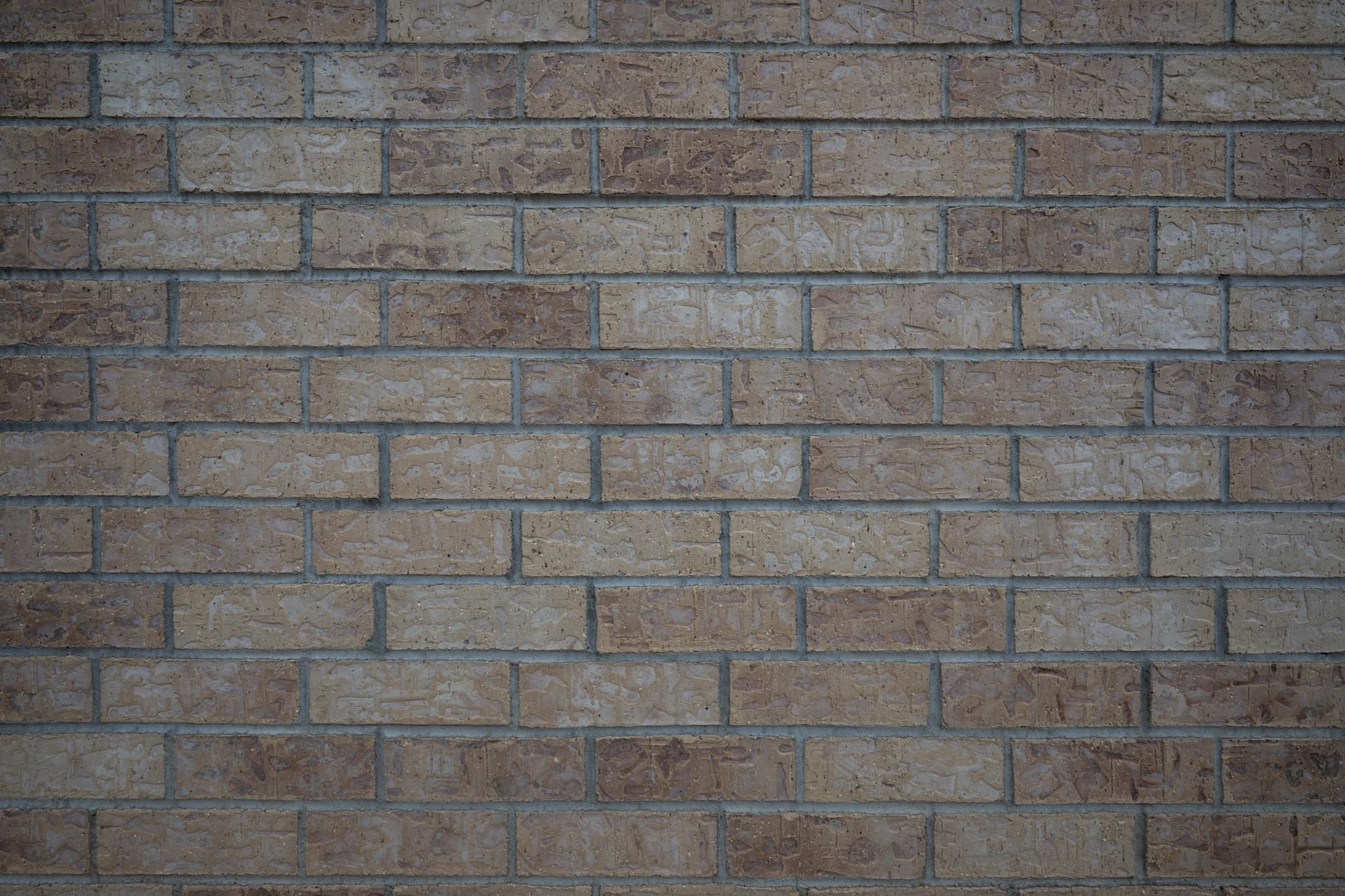 A flat, square-on tripod image facing a brick wall or geometric grid at 14mm to test for native barrel or pincushion distortion