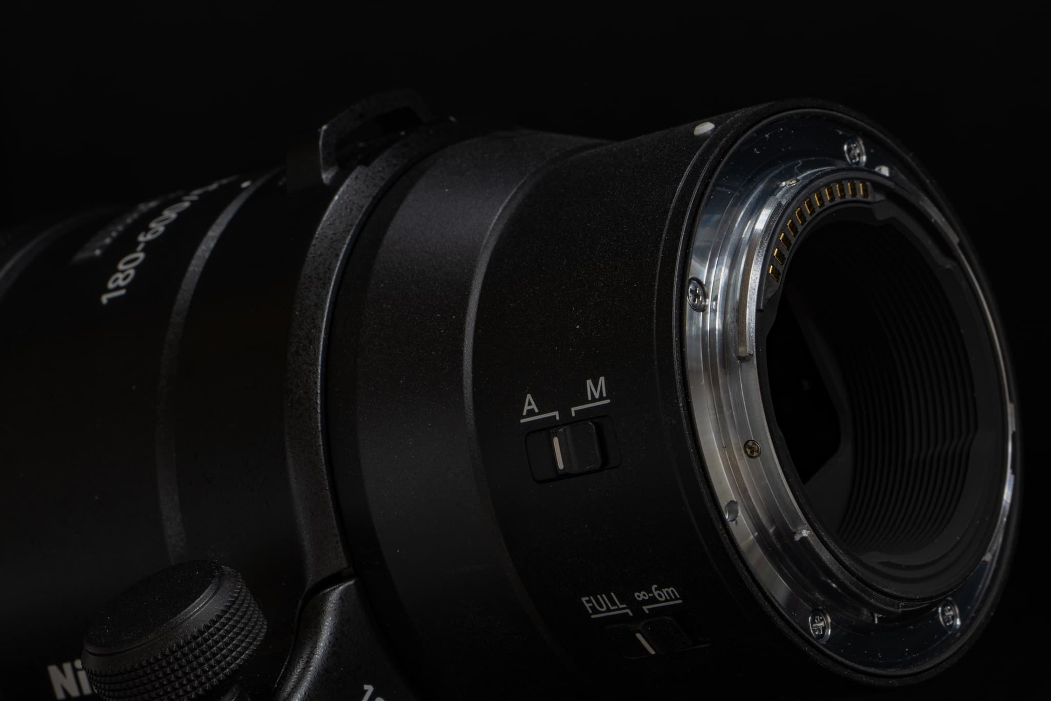 Close-up focusing on the black rubber weather-sealing gasket lining of the Nikon Z 180-600mm f/5.6-6.3 VR