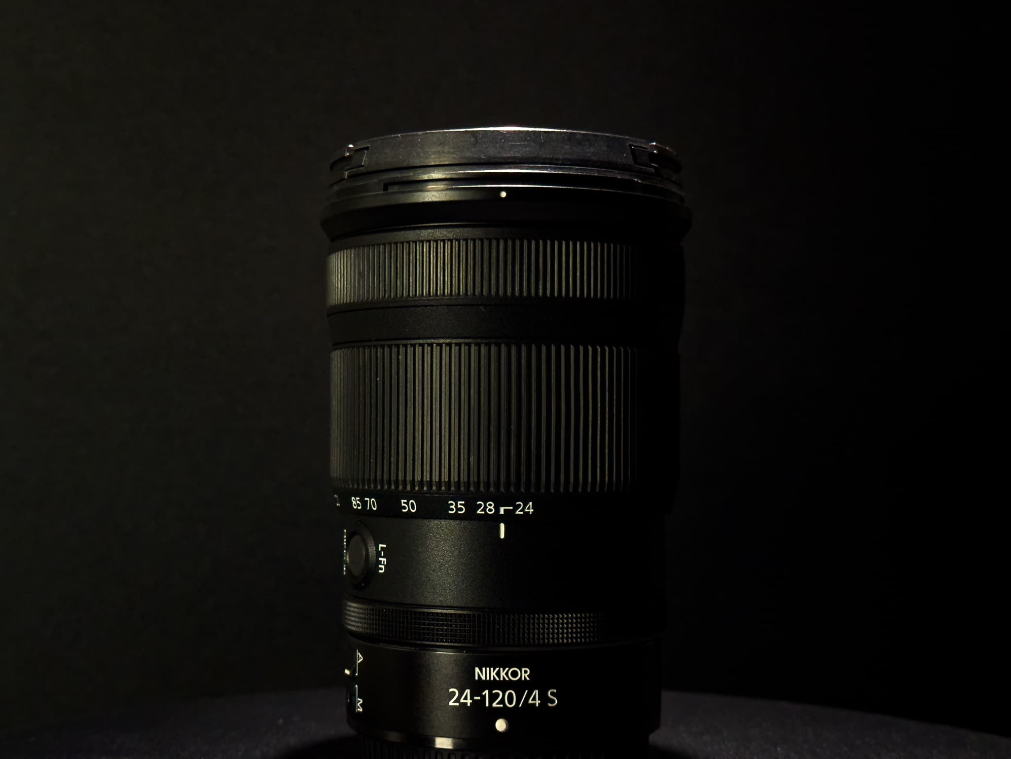 Profile shot of the lens barrel of the Nikon Z 24-120mm f/4 S at its collapsed 24mm state, focusing on the cleanly engraved focal length markings (24, 35, 50, 70, 85, 120)