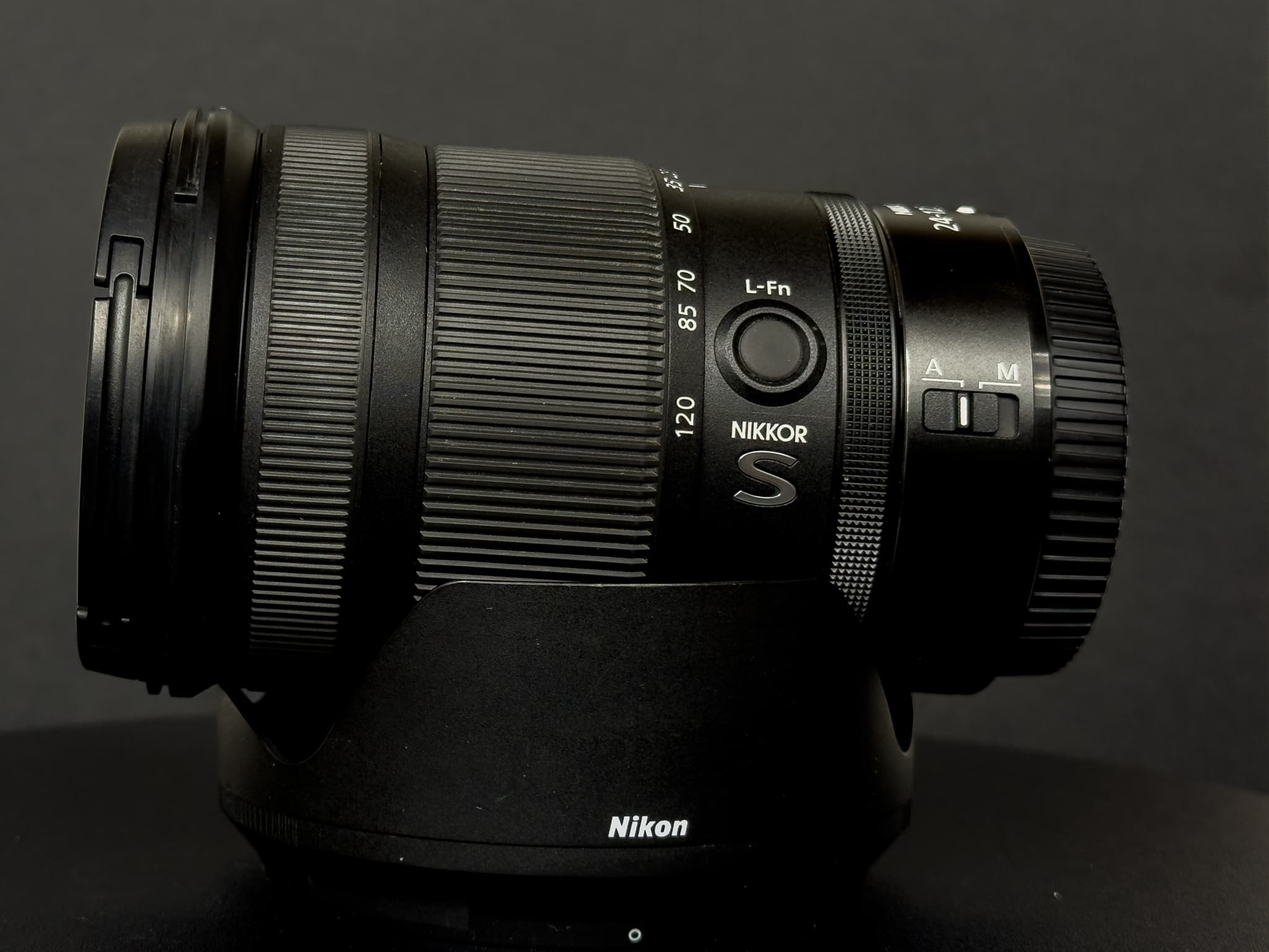 Showcasing the physical extension of the dual-cam inner barrel of the Nikon Z 24-120mm f/4 S zooming from the compact 24mm position