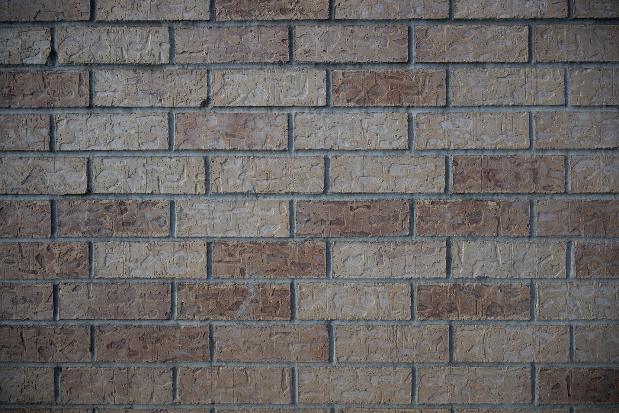 Flat, square-on tripod image facing a uniform brick wall at 24mm f/4 on the Nikon Z 24-120mm f/4 S: one raw uncorrected frame to evaluate native barrel distortion, and one with in-camera profile corrections applied