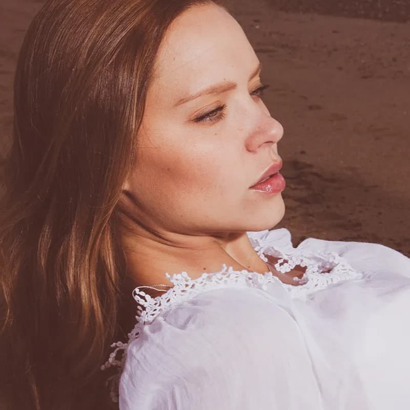 Woman laying down looking up.
