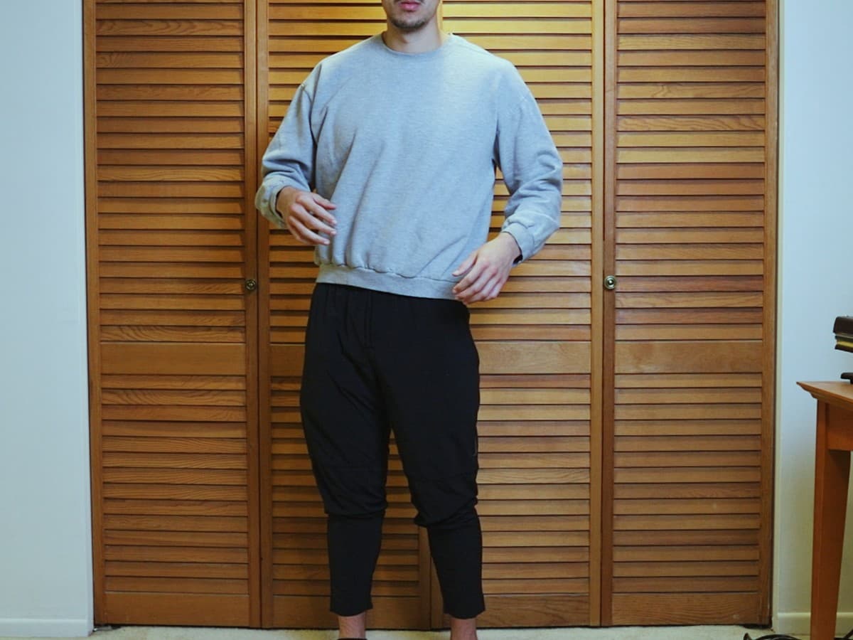 Man posing by moving his waist but not shoulders.