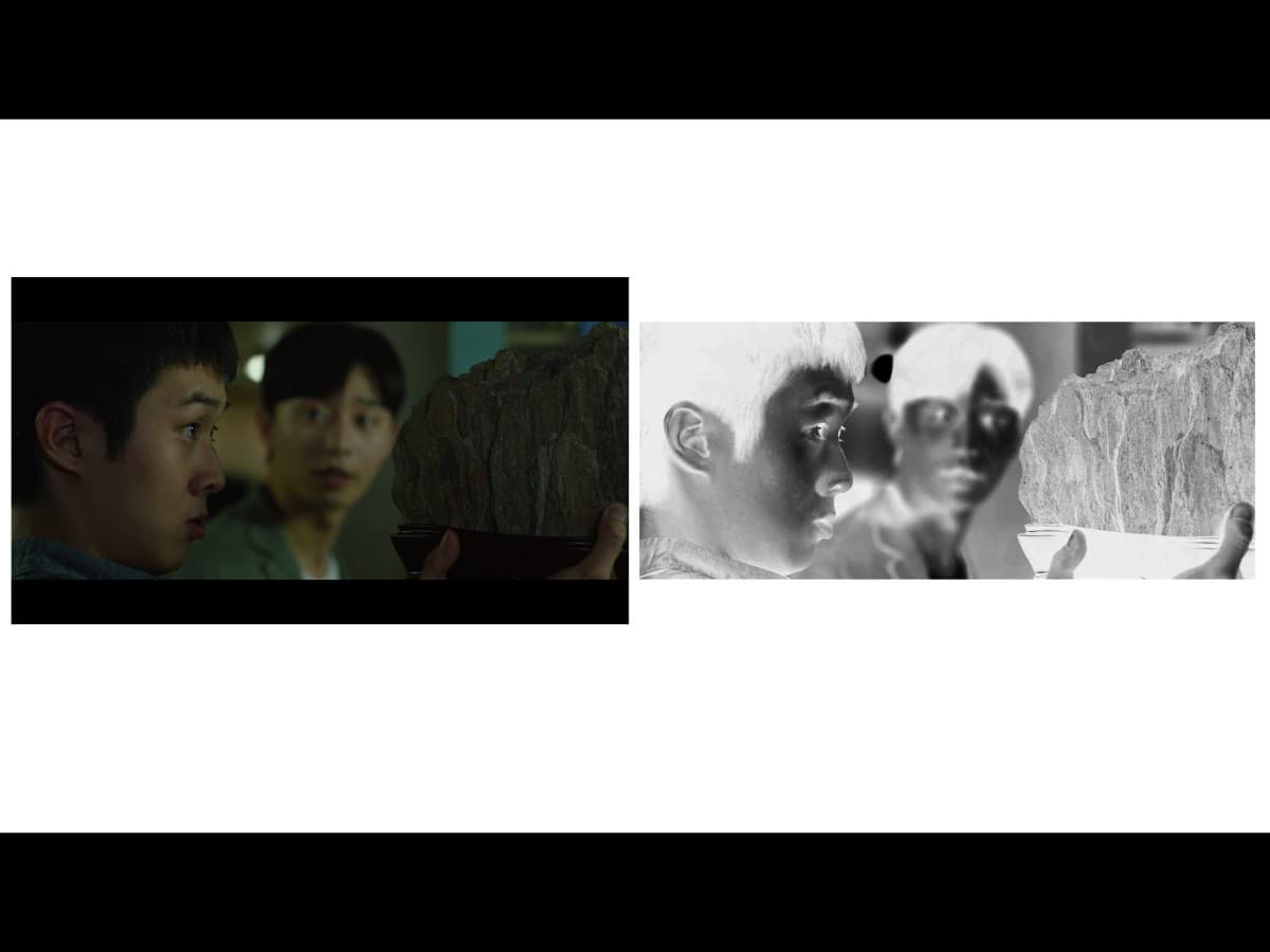 Lighting from scene from Parasite where Ki-Woo is gifted scholar's rock.