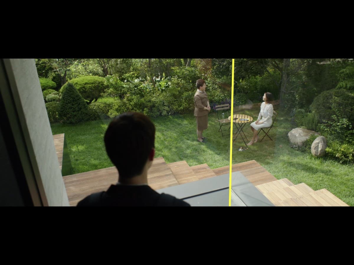 Framing composition from scene in Parasite where Ki-Woo looking at maid and wife.