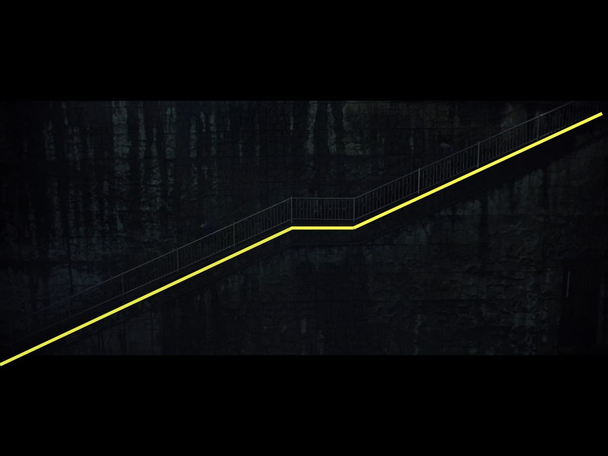 Composition from scene in parasite where Kim family is running up stairs in rain.