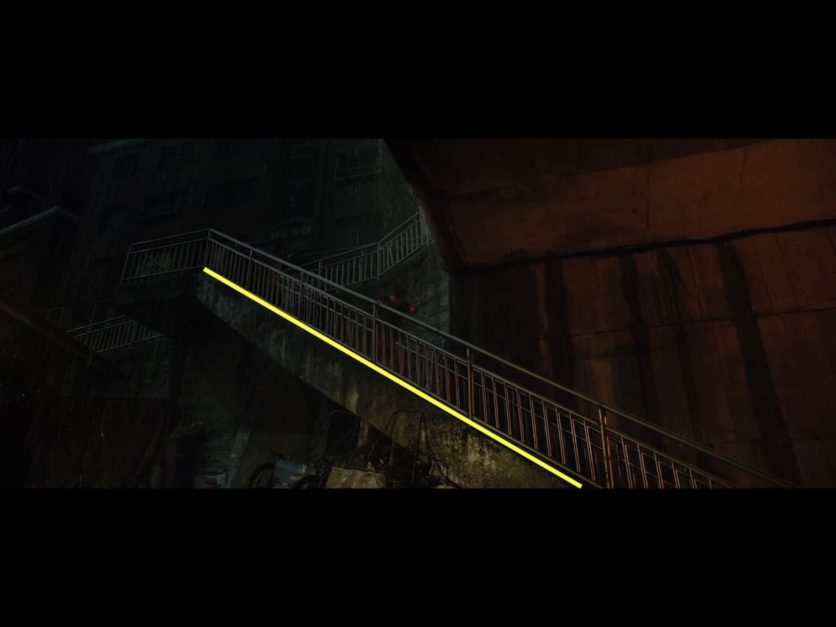 Composition from scene in parasite where Kim family is running up stairs in rain.