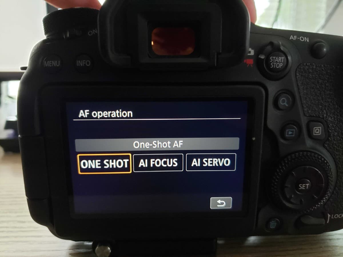 Single autofocus mode on the back of a camera.