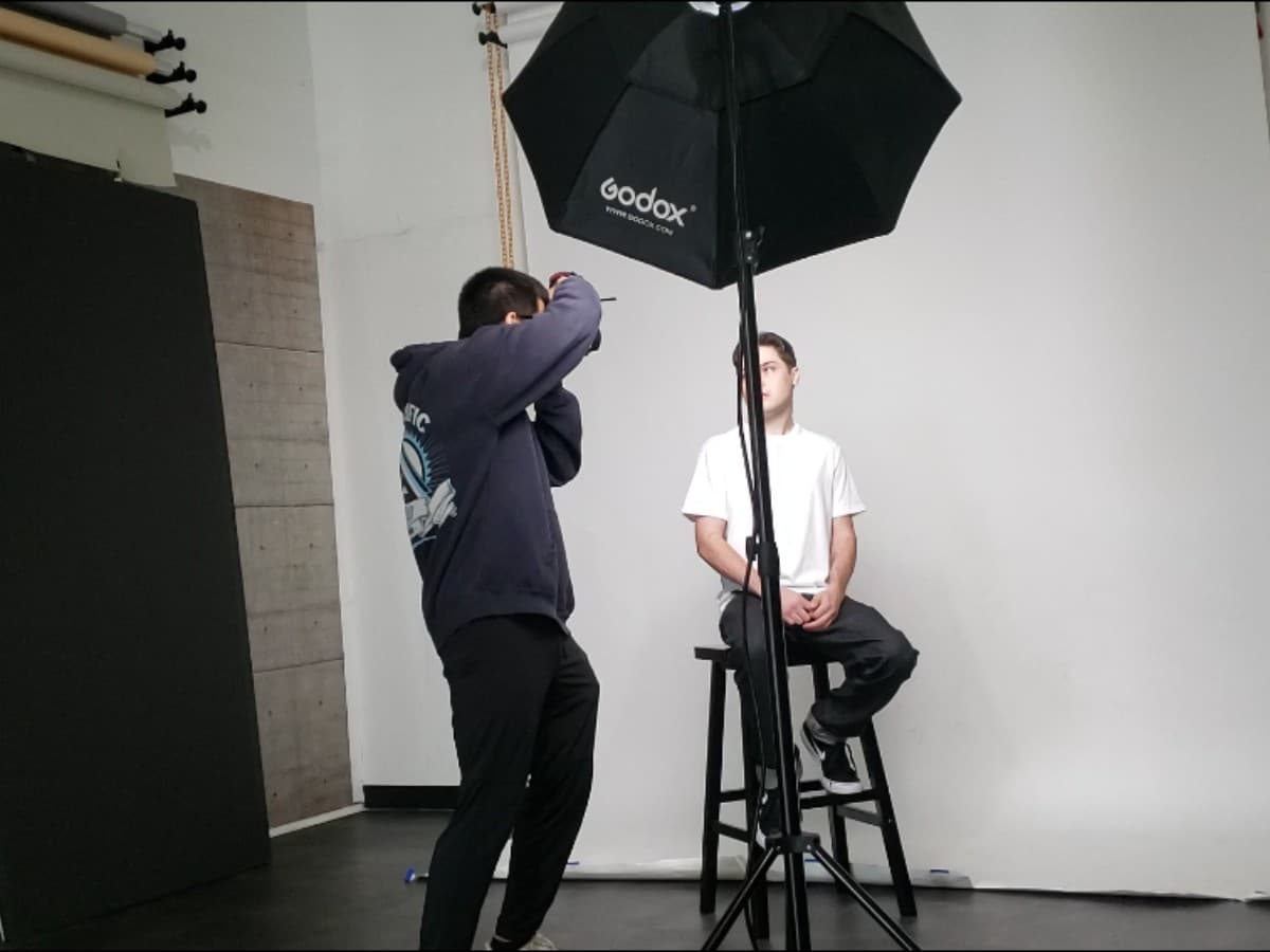 Using external lighting outside for photoshoot.