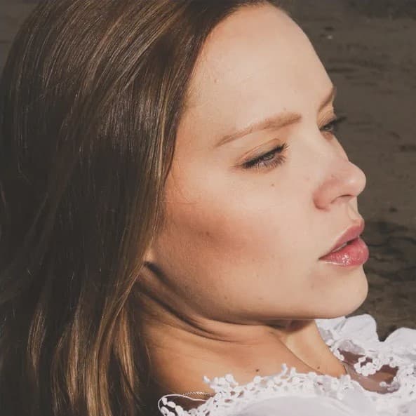 Woman laying down looking up.