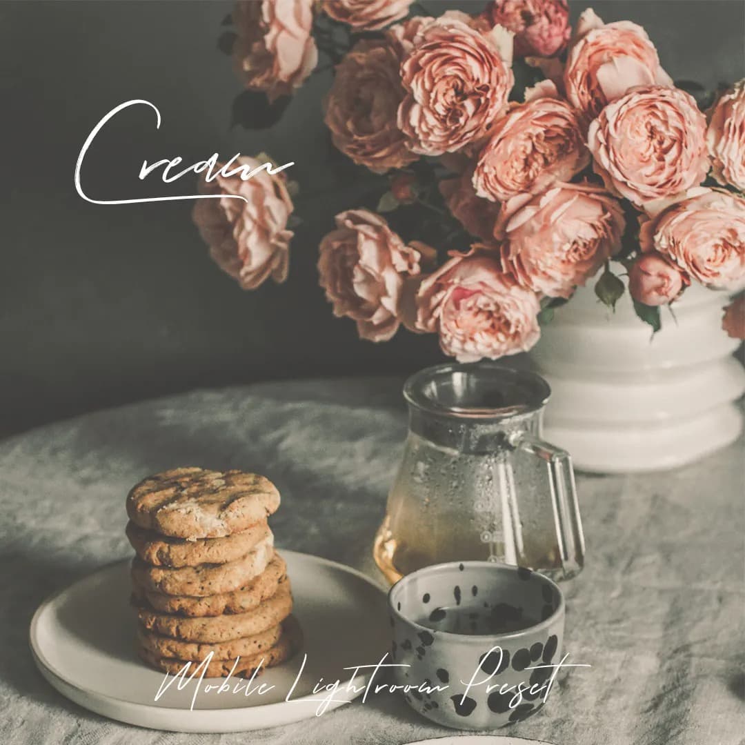 Flower and cookies sitting on table.