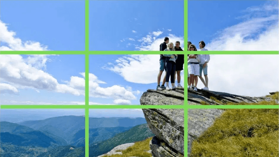 A group serving as single focal point Group of people standing on a cliff.