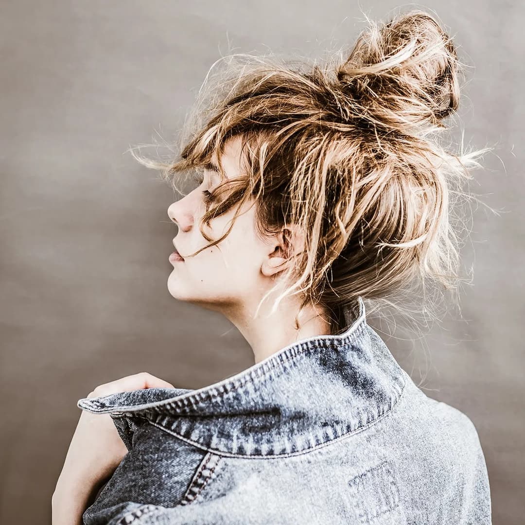 Blonde woman in jean jacket.