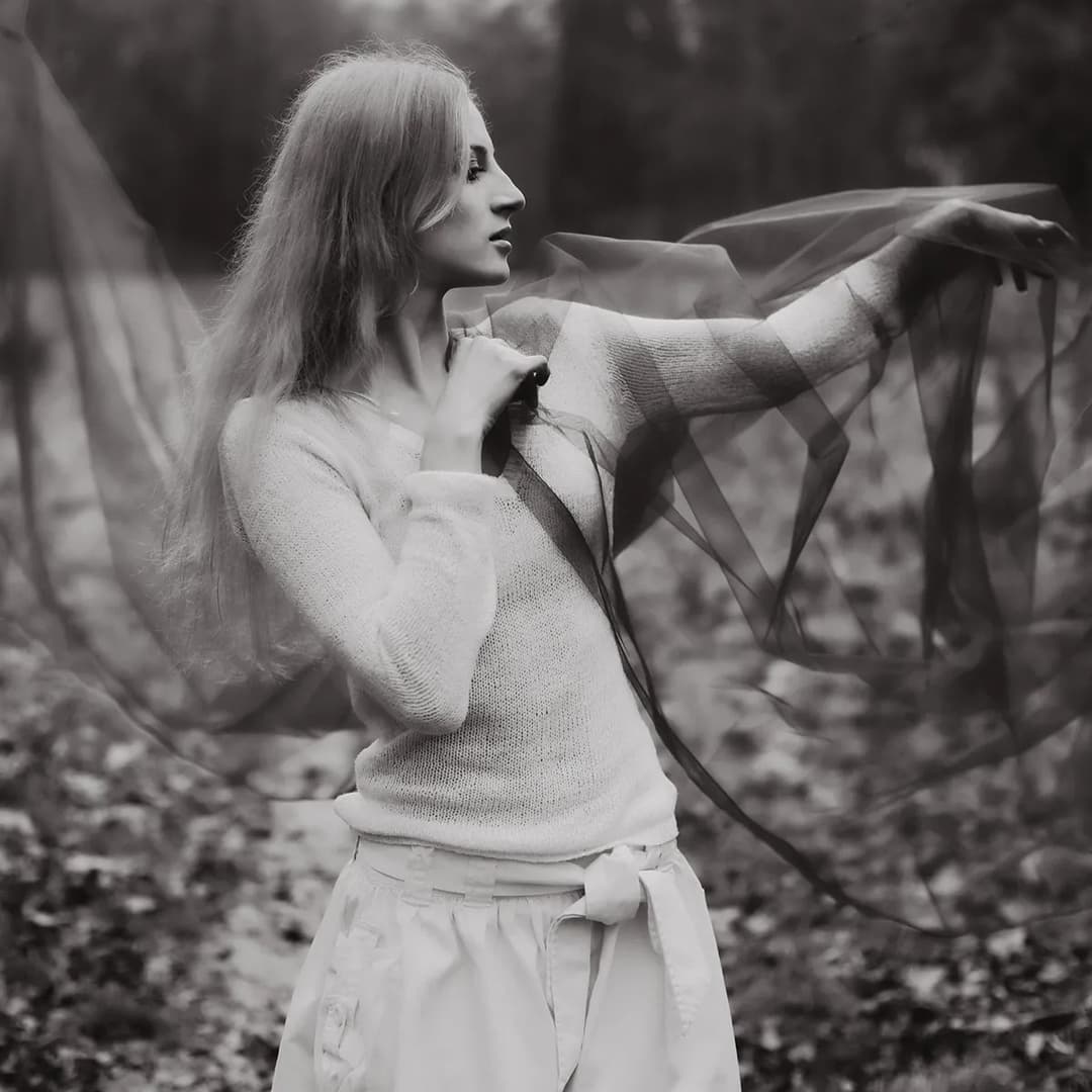 Woman playing with silk screen.
