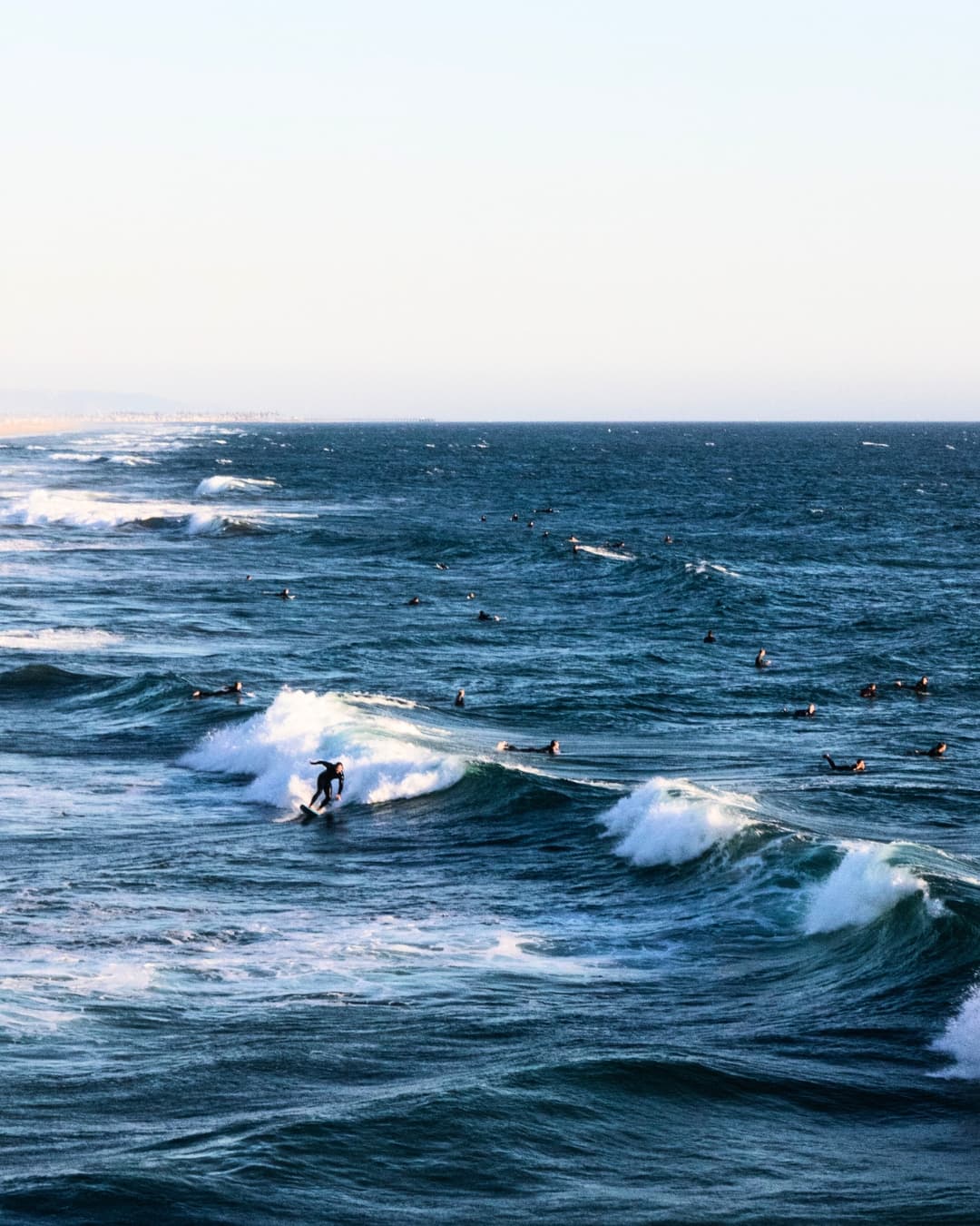 Surf scene with increased contrast Surfers in the water with increased contrast on the water.