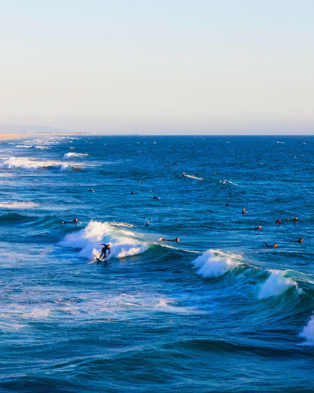 Surf scene with increased saturation Surfers in the water with increased saturation on the water.