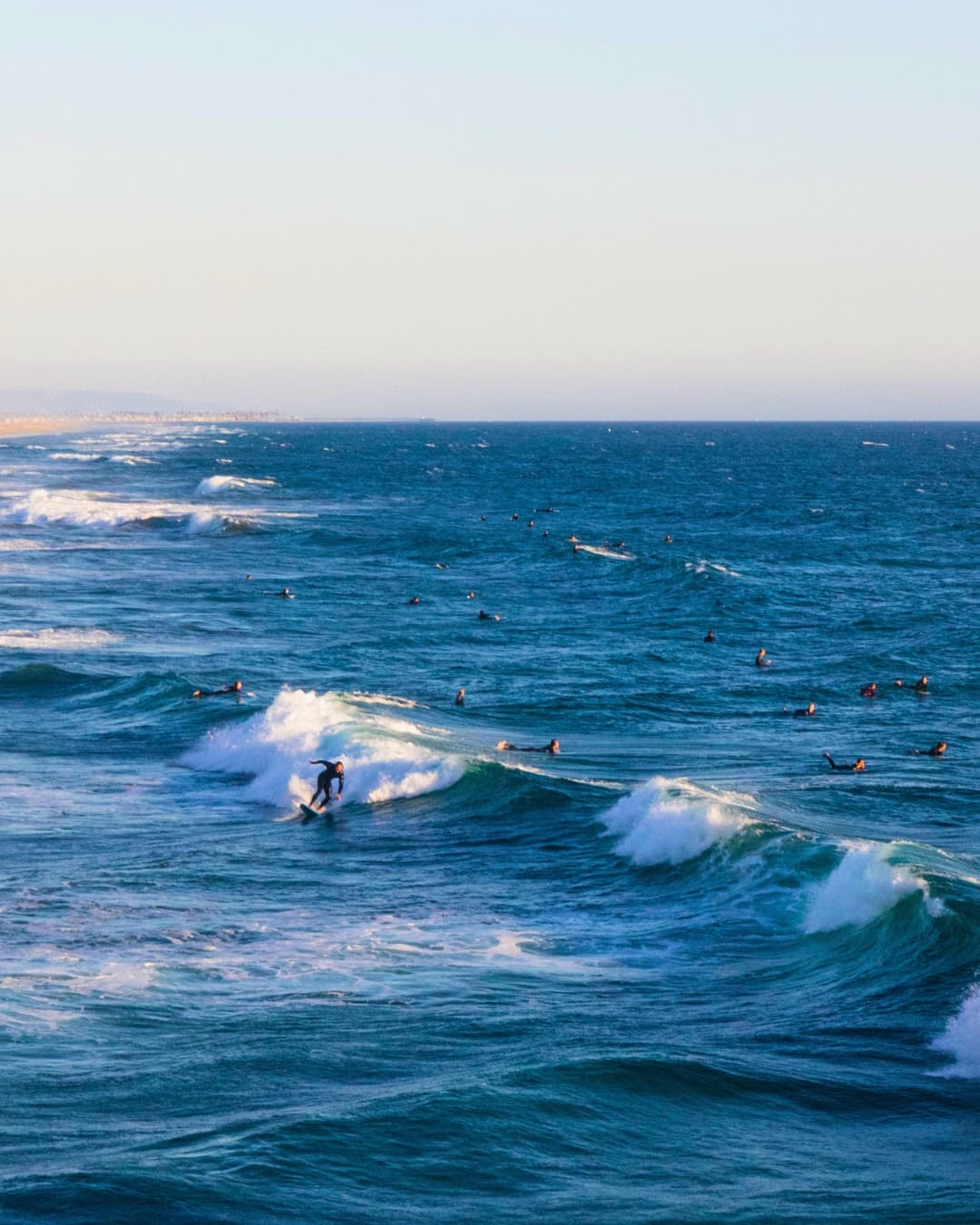 Surf scene with increased vibrance Surfers in the water with increased vibrance on the water.