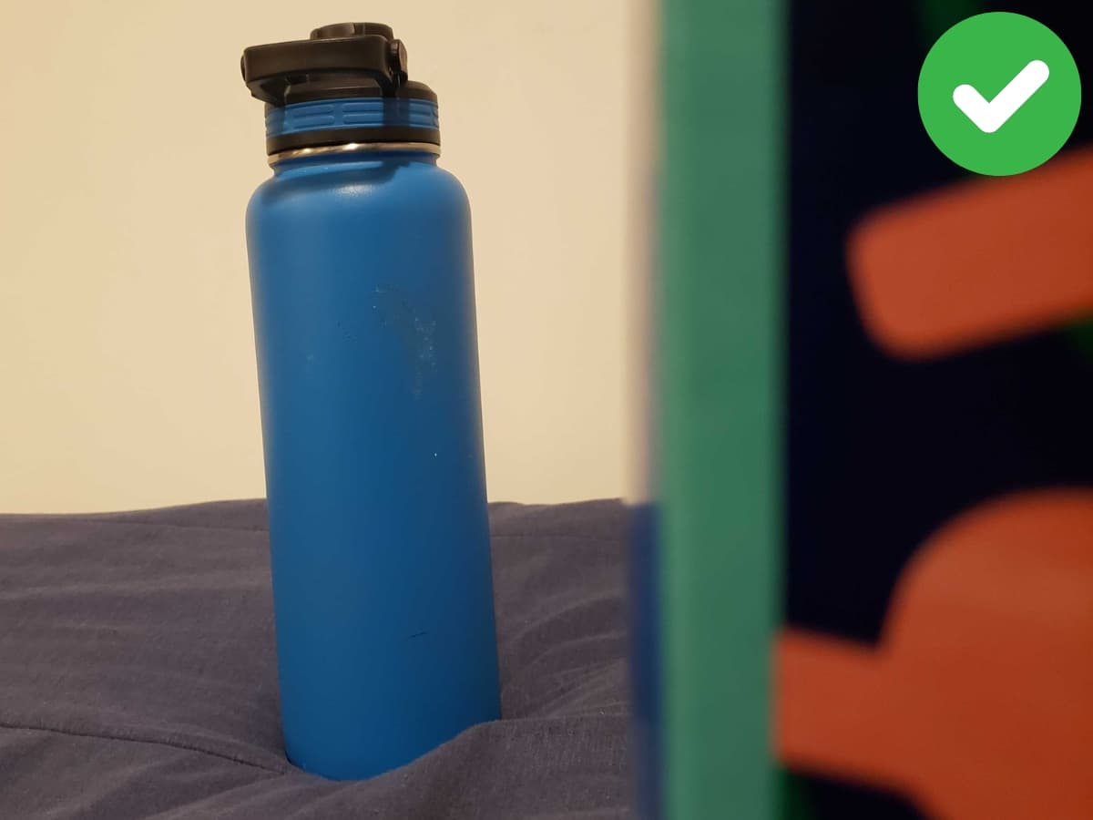 Correctly framing on one side Water bottle next to tissue box with correct framing.