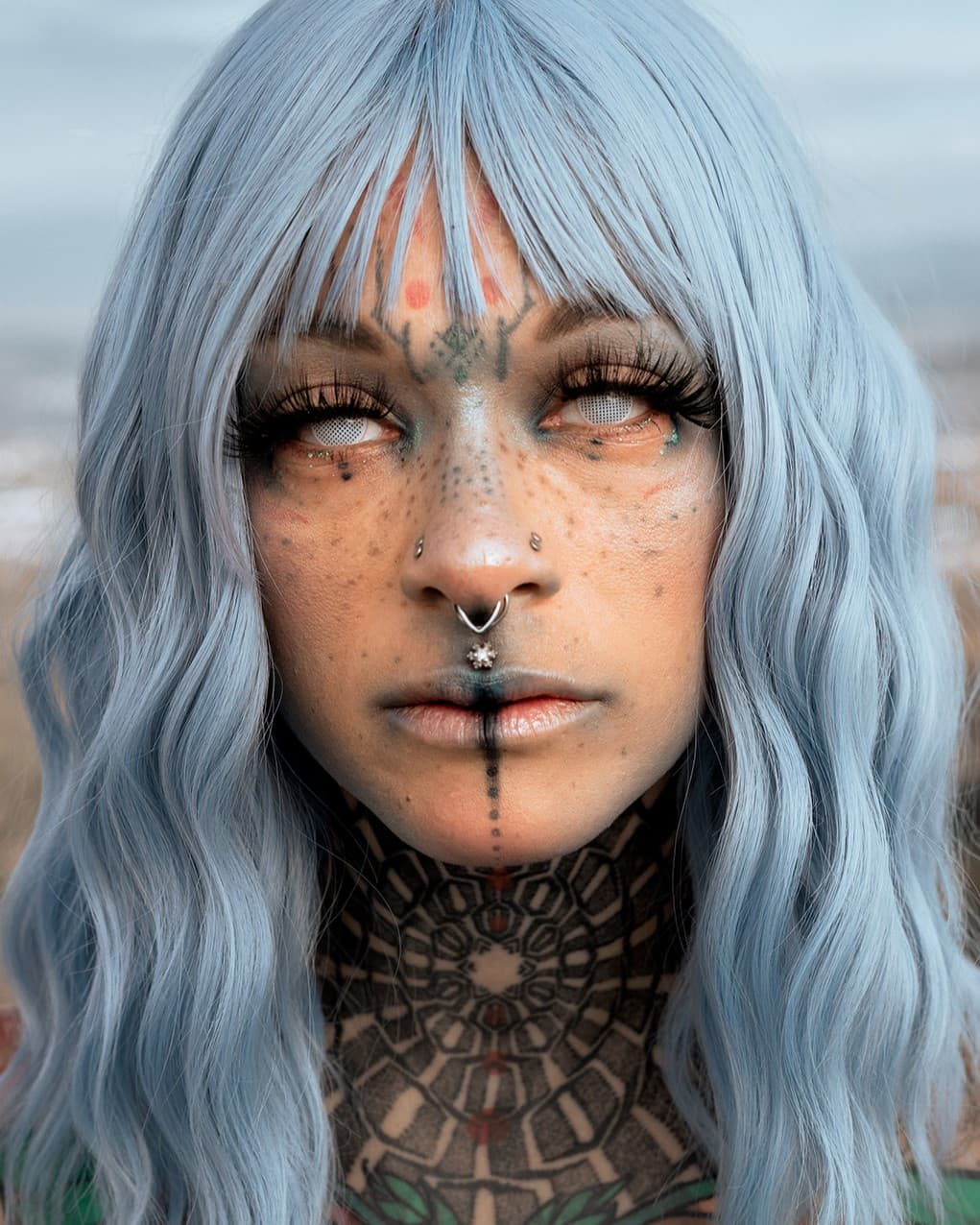 Filling the frame Girl with face tattoos and white hair for a headshot photo.