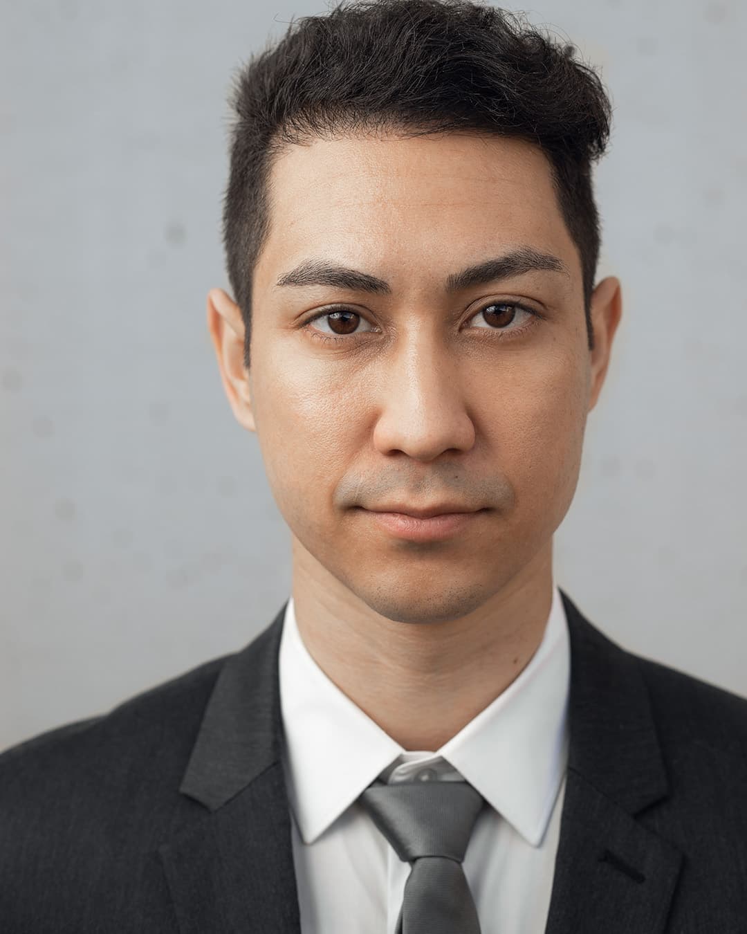 Low ISO (No grain/noise) Man wearing suit in a no noise photo.
