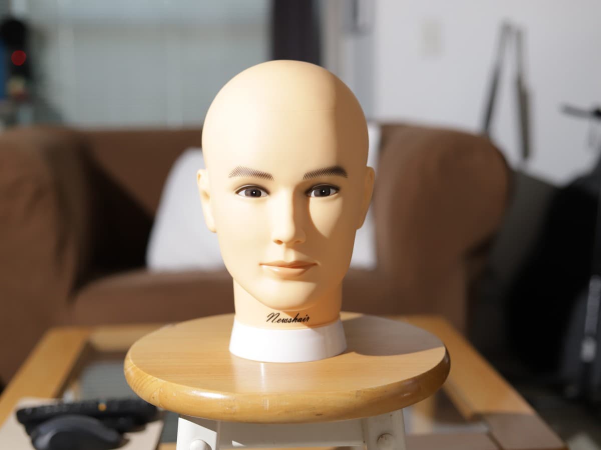 Image before adding shirt as diffuser Mannequin head on stool lit up with a speedlight without a diffuser.