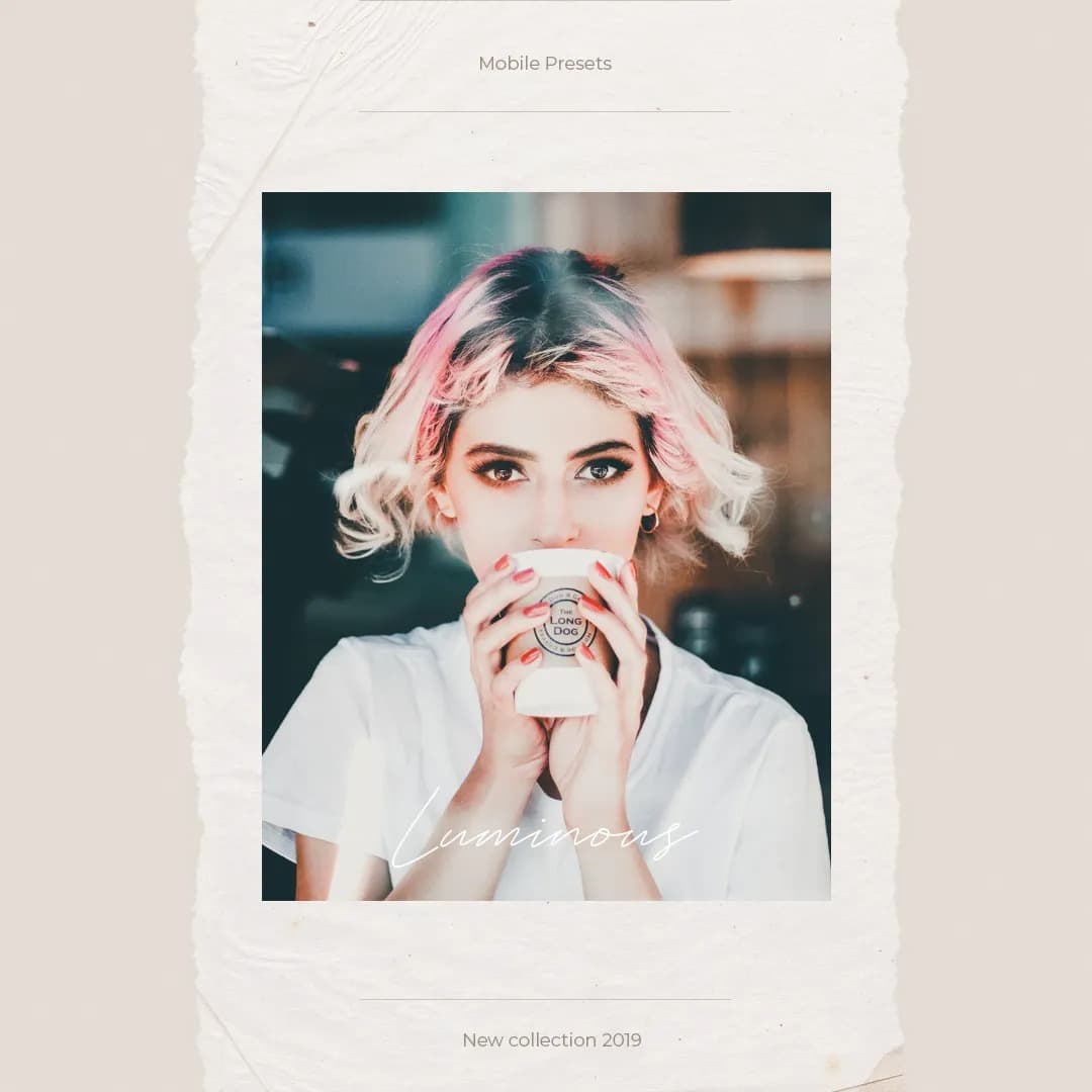 Girl with pink dyed hair sipping coffee looking at camera.