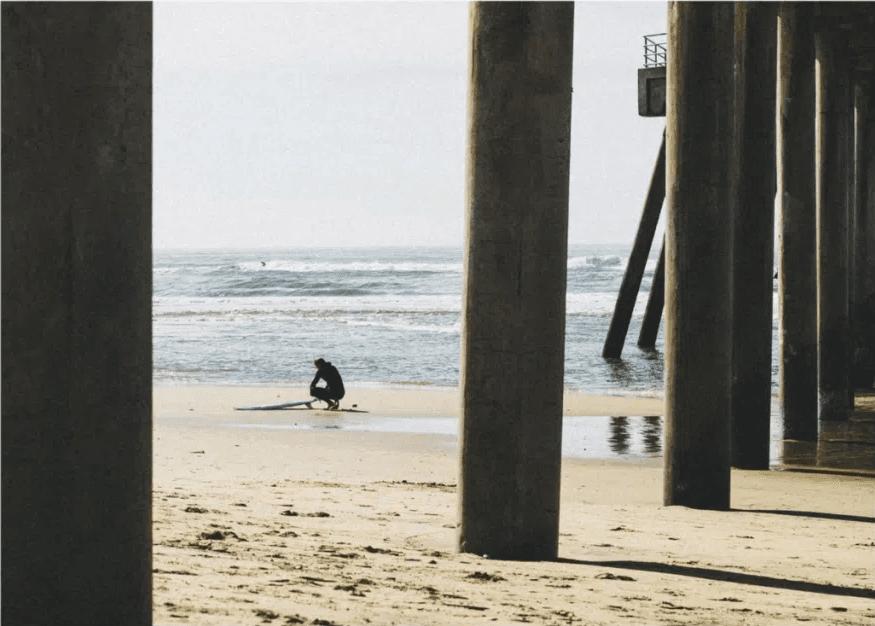 Intentional noise or grain added Intentional grain added to a beach photo under the pier.