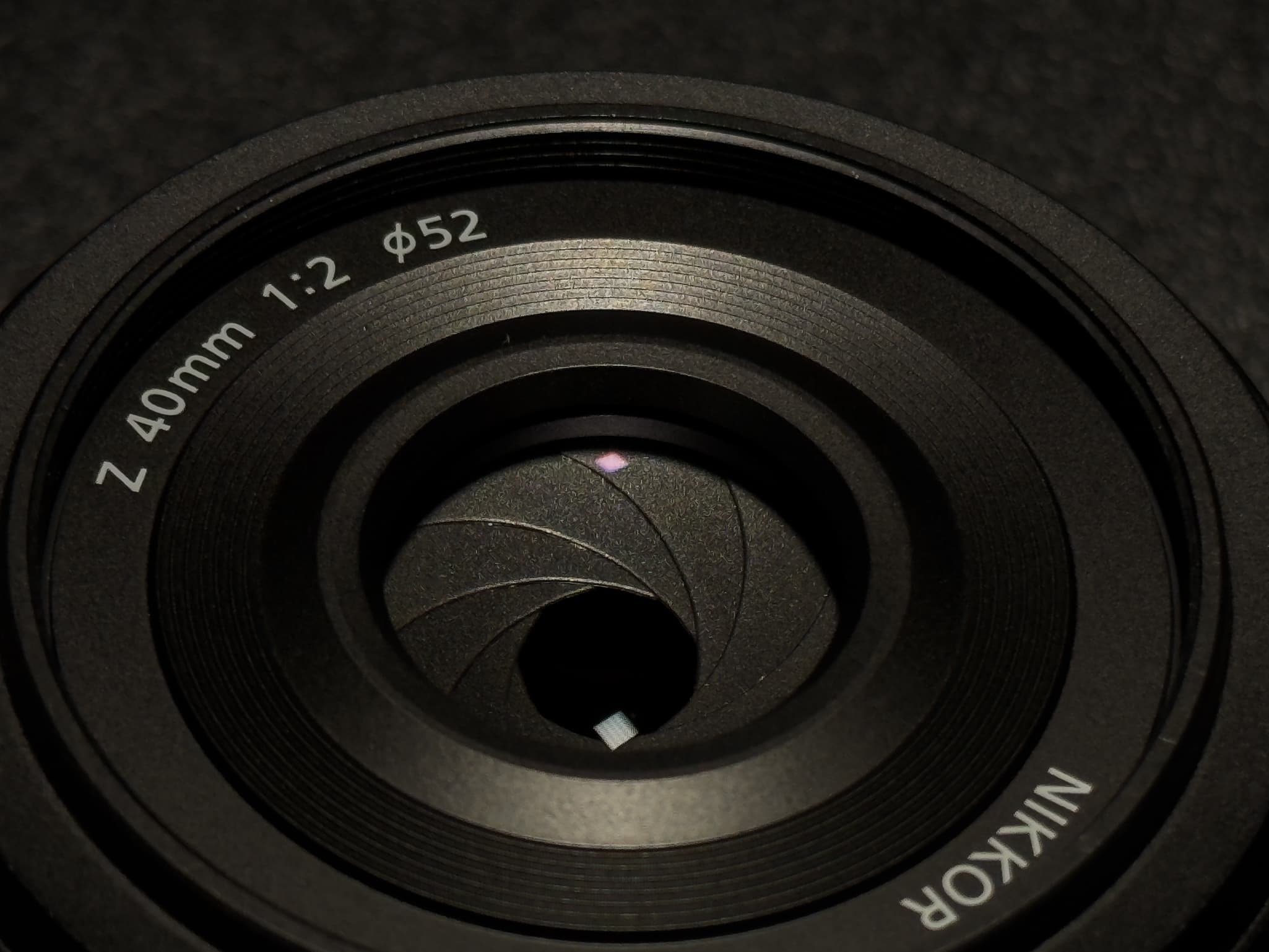 Angled shot of the Nikon Z 40mm f/2 showcasing Super Integrated Coating