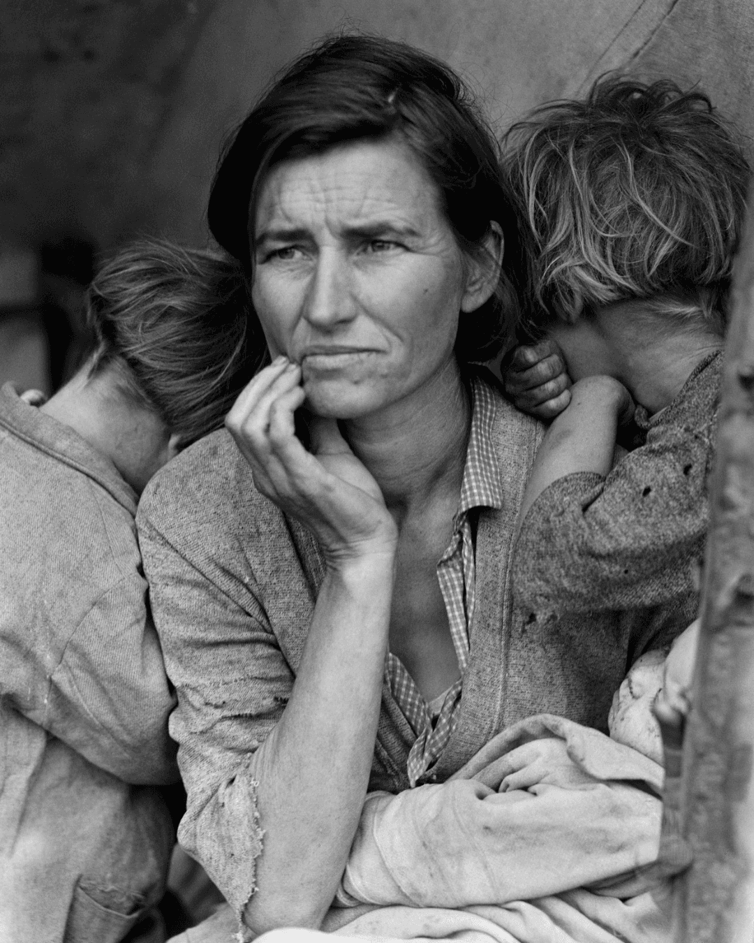 Dorothea Lange. Migrant Mother, Nipomo, California. March 1936 Using Framing Mother looking into distance with two kids holding her.