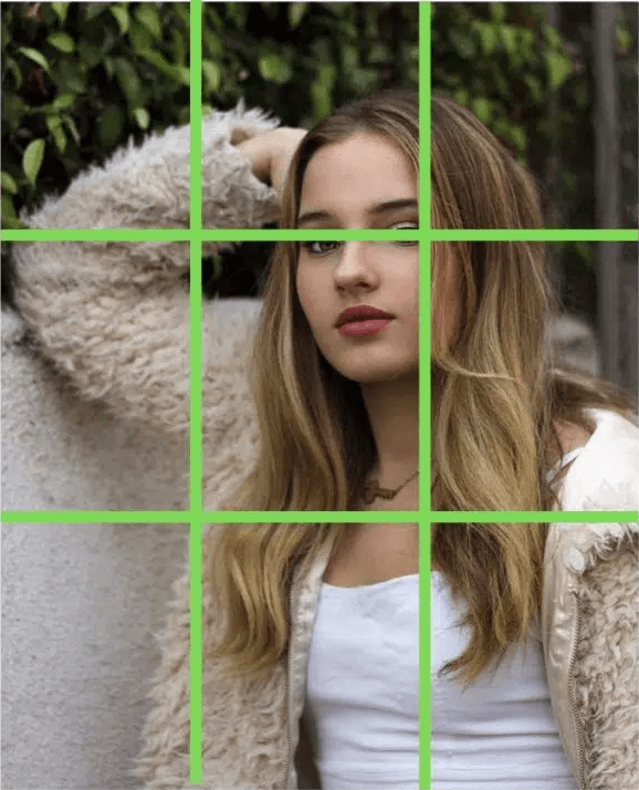 Using rule of thirds Girl wearing fur coat resting on wall with rule of thirds.