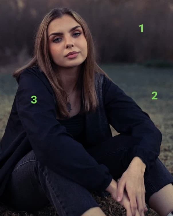 Simplicity Girl sitting on grass.